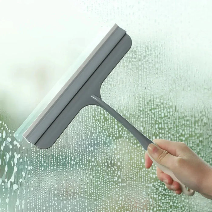 A bathroom shower squeegee for cleaning shower doors and car windows, an efficient surface cleaning tool.